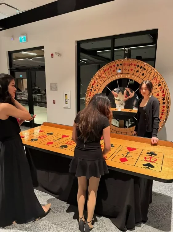 Guests playing at the casino wheel
